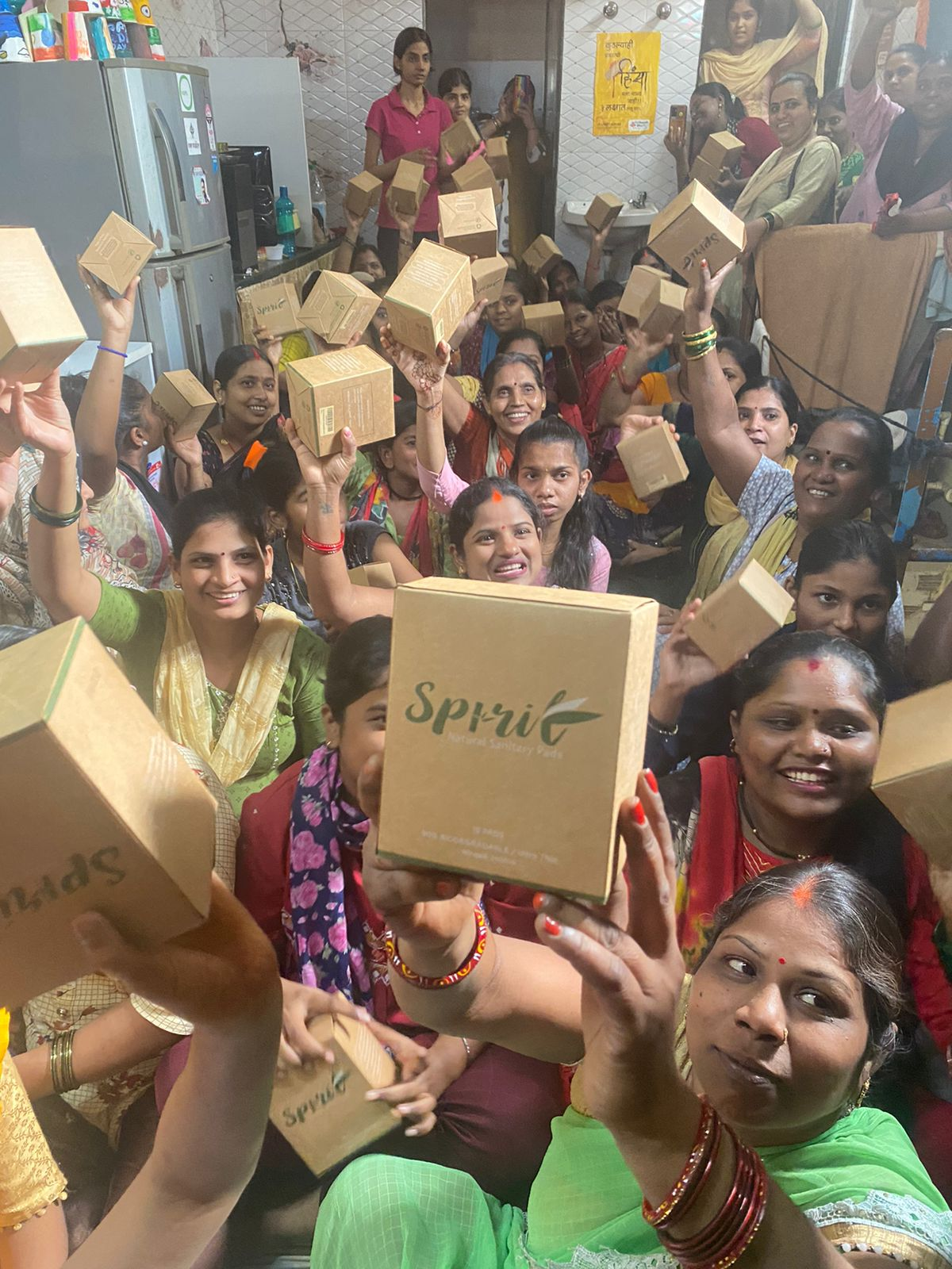 Poor Indian women holding Spirit Sanitary Pads